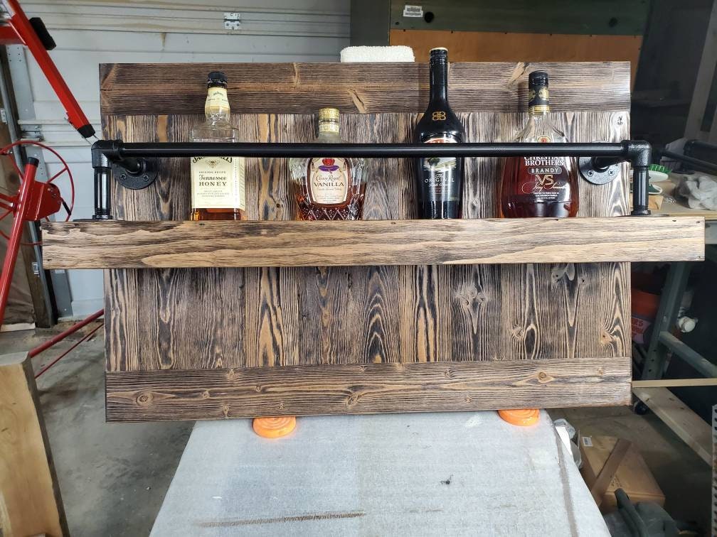 Rustic Reclaimed Wood Liquor and Wine Shelf with Pipe Construction: Handcrafted for Home Bar & Stemware Storage