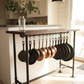 Kitchen island with hanging pans and pendant lights in a home setting