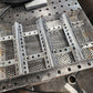 11" x 17" wood pellet insert in a perforated metal basket from a slight angle