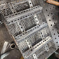 11" x 17" wood pellet insert in a perforated metal basket from a slight overhead angle