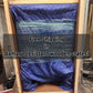 Rustic barnwood nightstand packaged in a wooden crate, wrapped in blue padding; country-style bedside table with a drawer.